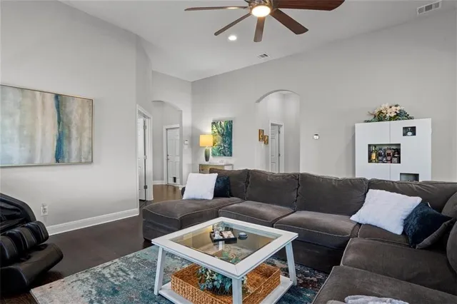 a living room with furniture and a rug