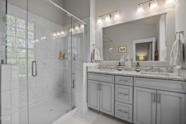 a living room with furniture large window and a fireplace