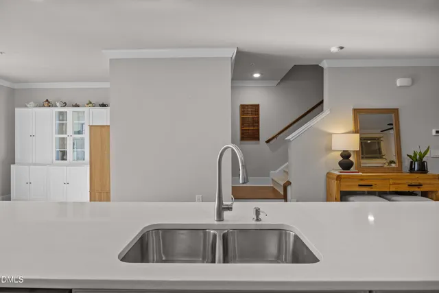 a kitchen with a sink and a refrigerator