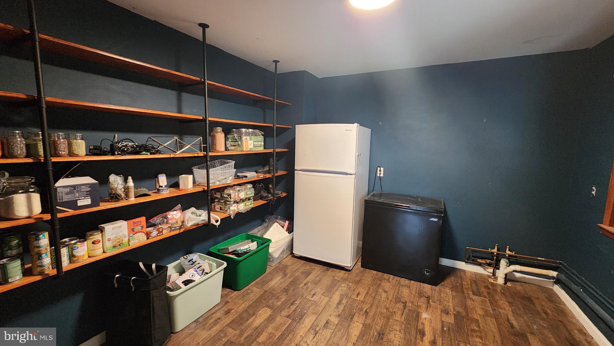 26732 Idlewild Road Federalsburg, MD 21632 - Photo 4 of 15 a view of a kitchen with fridge and rack
