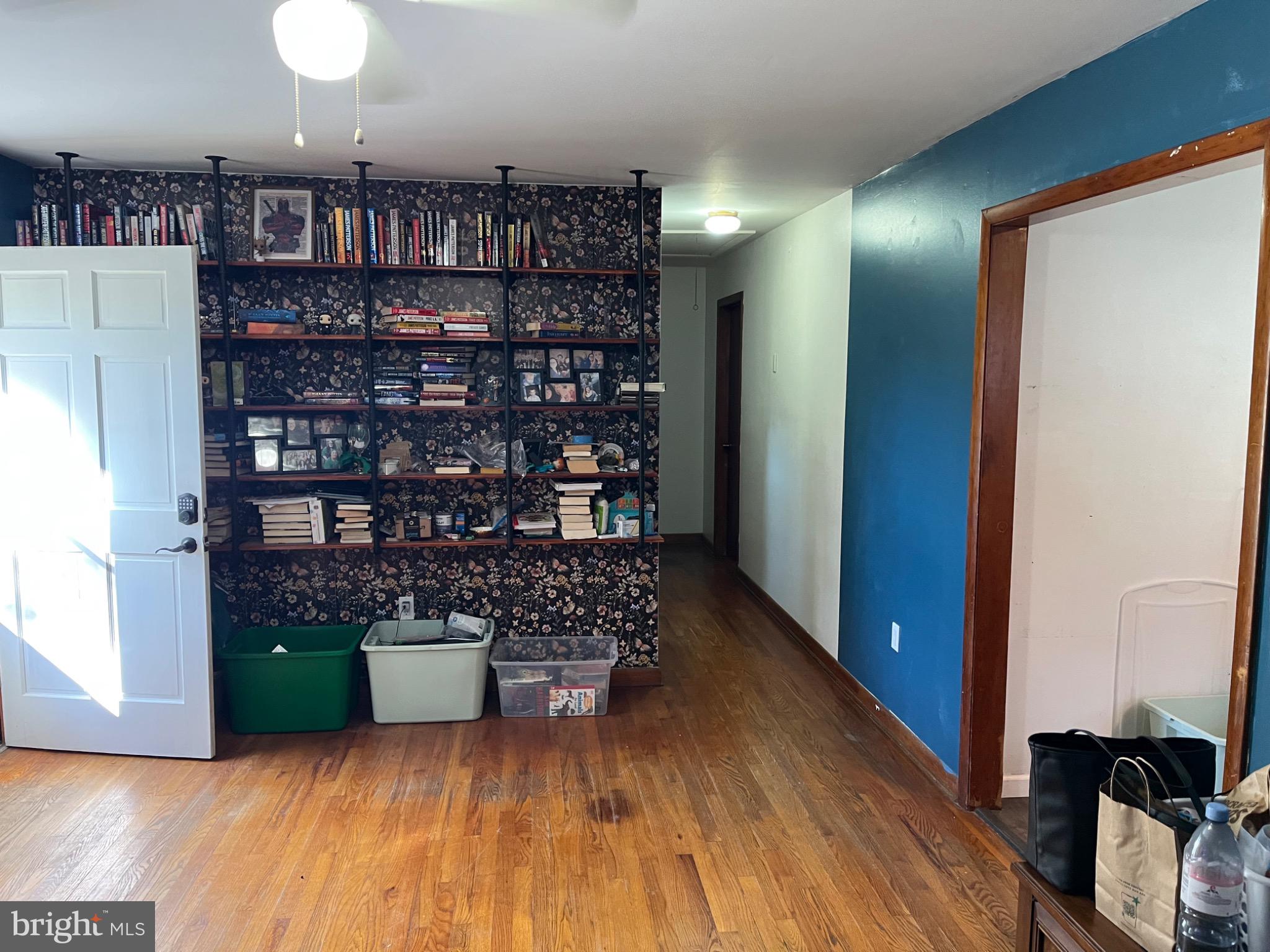 26732 Idlewild Road Federalsburg, MD 21632 - Photo 7 of 15 a room with lots of books and a large window