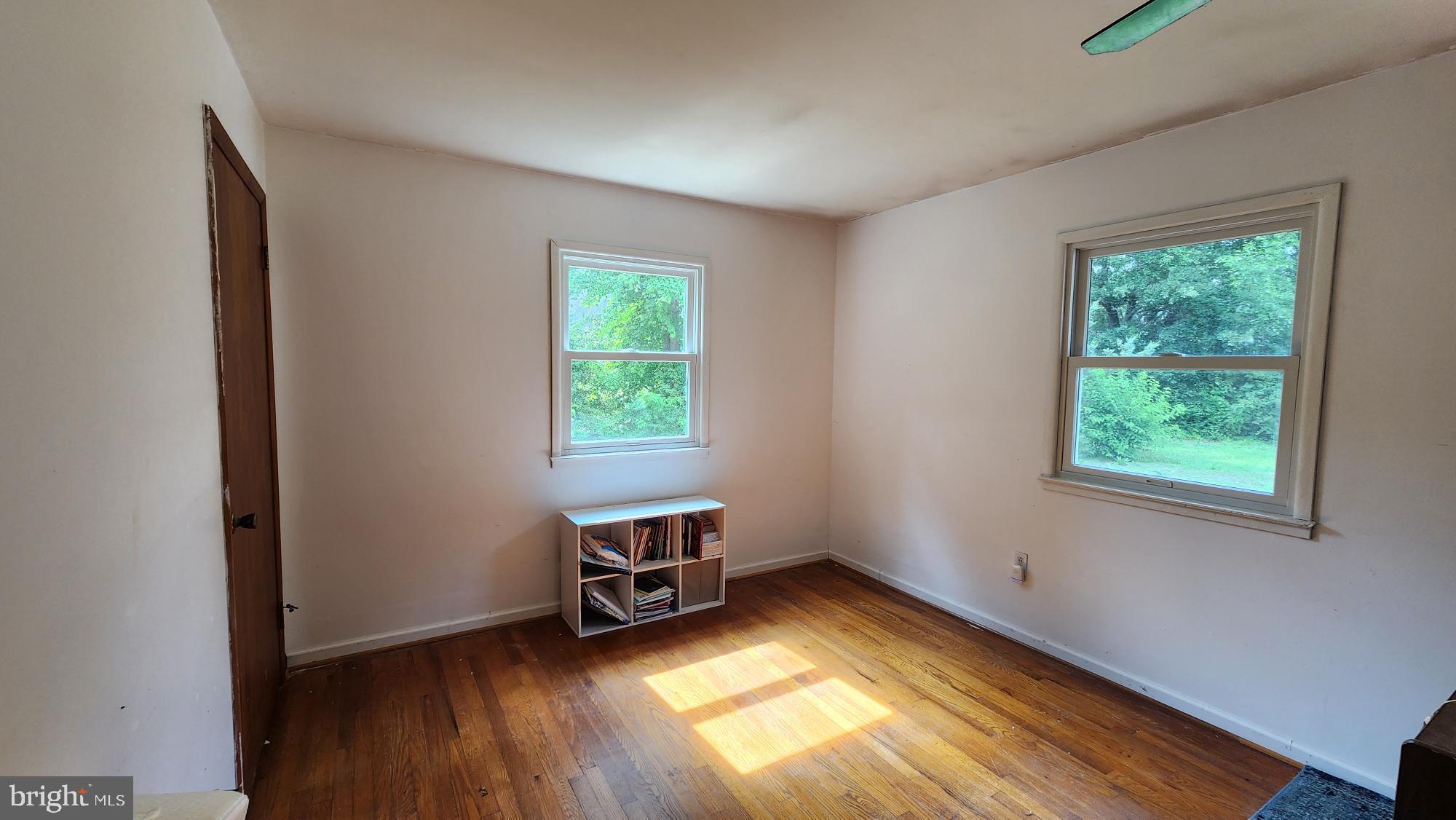 26732 Idlewild Road Federalsburg, MD 21632 - Photo 9 of 15 a view of empty room with wooden floor and fan