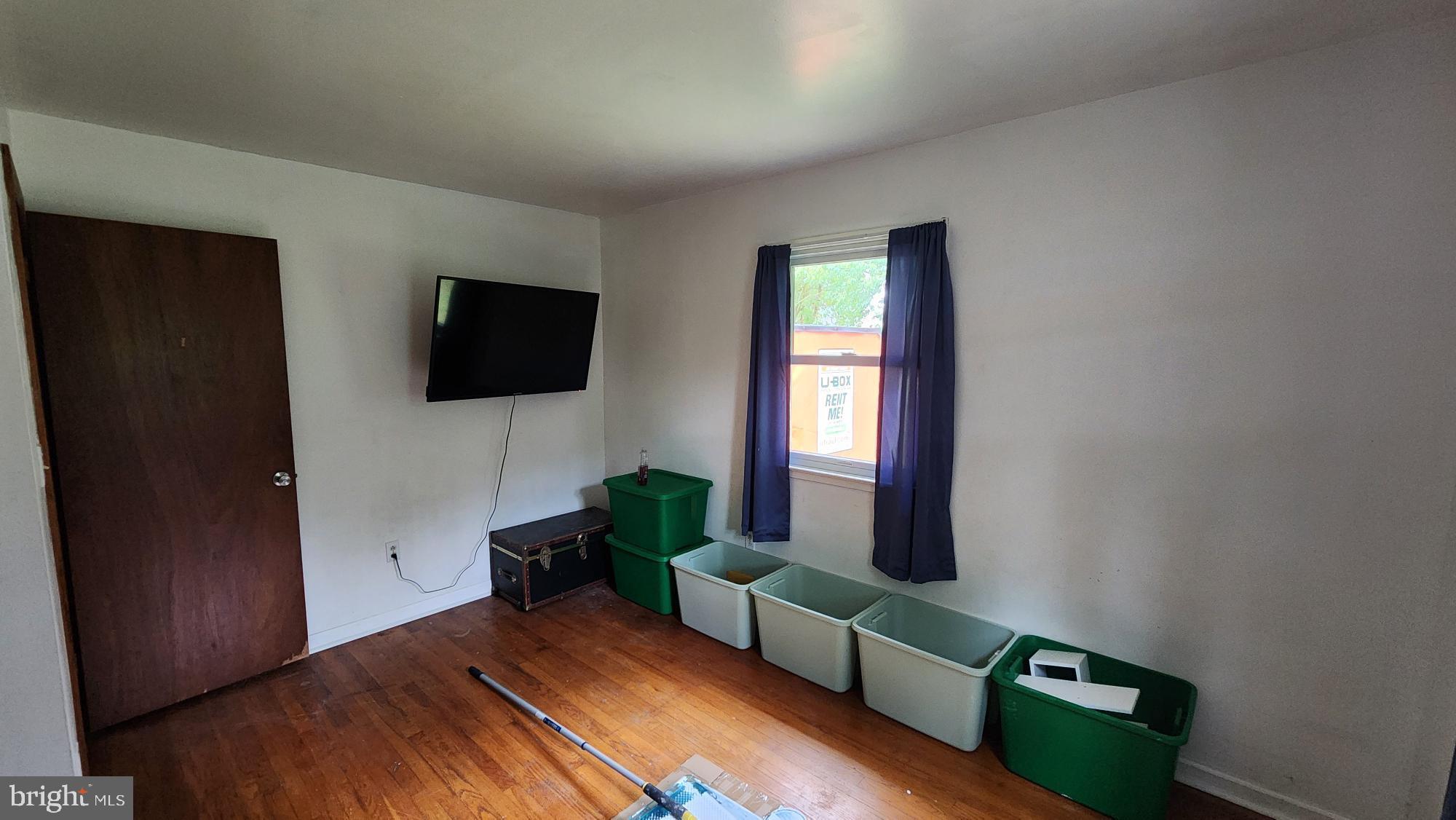 26732 Idlewild Road Federalsburg, MD 21632 - Photo 10 of 15 a living room with furniture and a flat screen tv