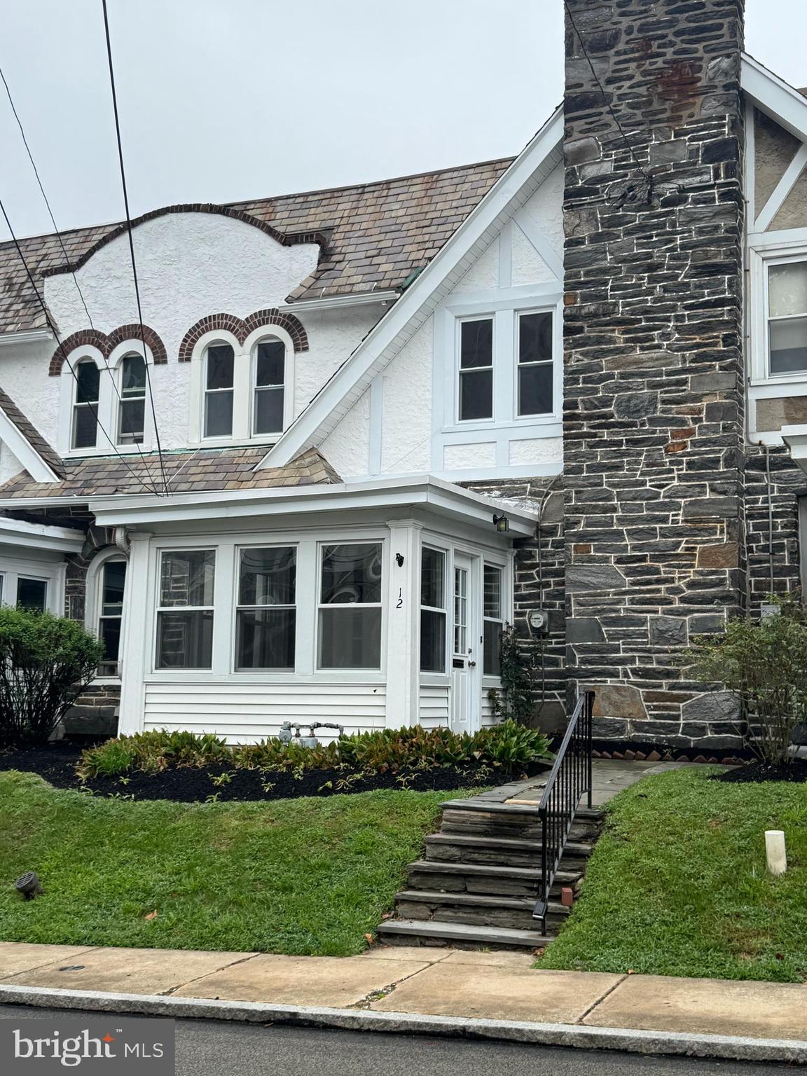 a house view with a garden space