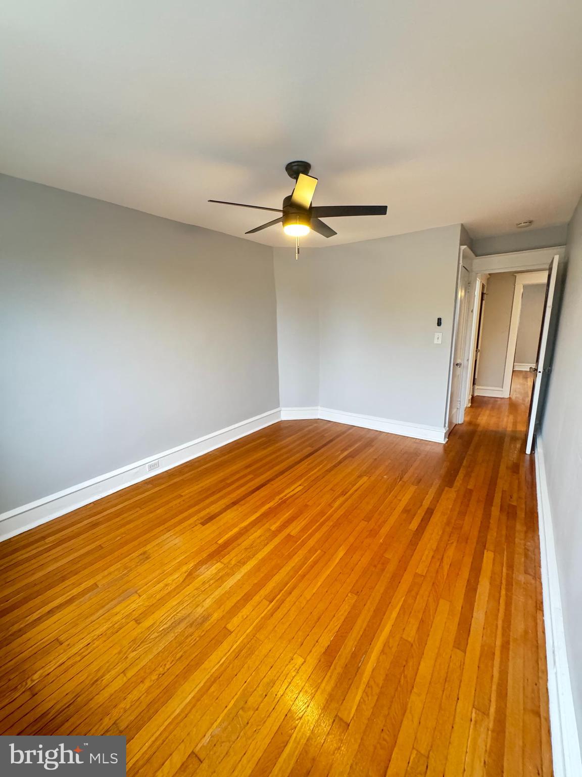 12 West Athens Avenue Ardmore, PA 19003 - Photo 14 of 18 a bedroom with a bed and a chandelier