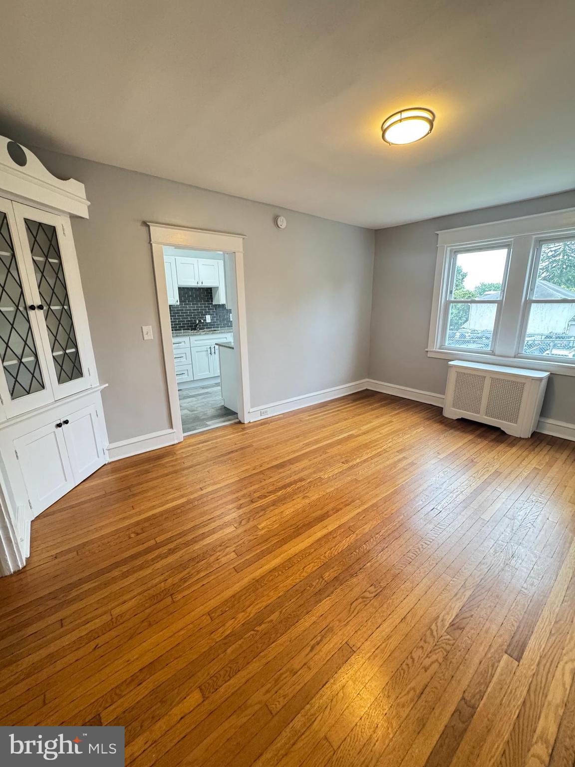 12 West Athens Avenue Ardmore, PA 19003 - Photo 5 of 18 a view of empty room with wooden floor and fan
