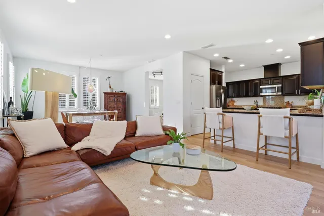 a dining room with furniture and window