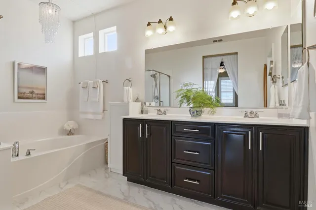 a backyard of a house with barbeque oven table and chairs