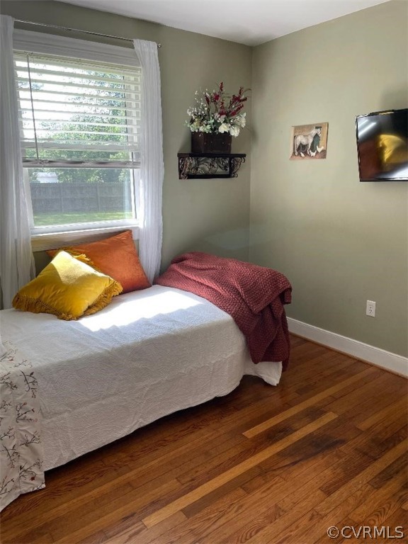 9201 Winterpock Road Chesterfield, VA 23832 - Photo 25 of 28 a bed sitting in a bedroom next to a window