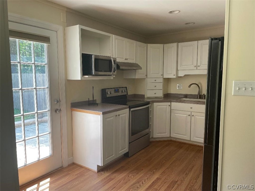 9201 Winterpock Road Chesterfield, VA 23832 - Photo 28 of 28 a kitchen with cabinets stainless steel appliances a sink and a window