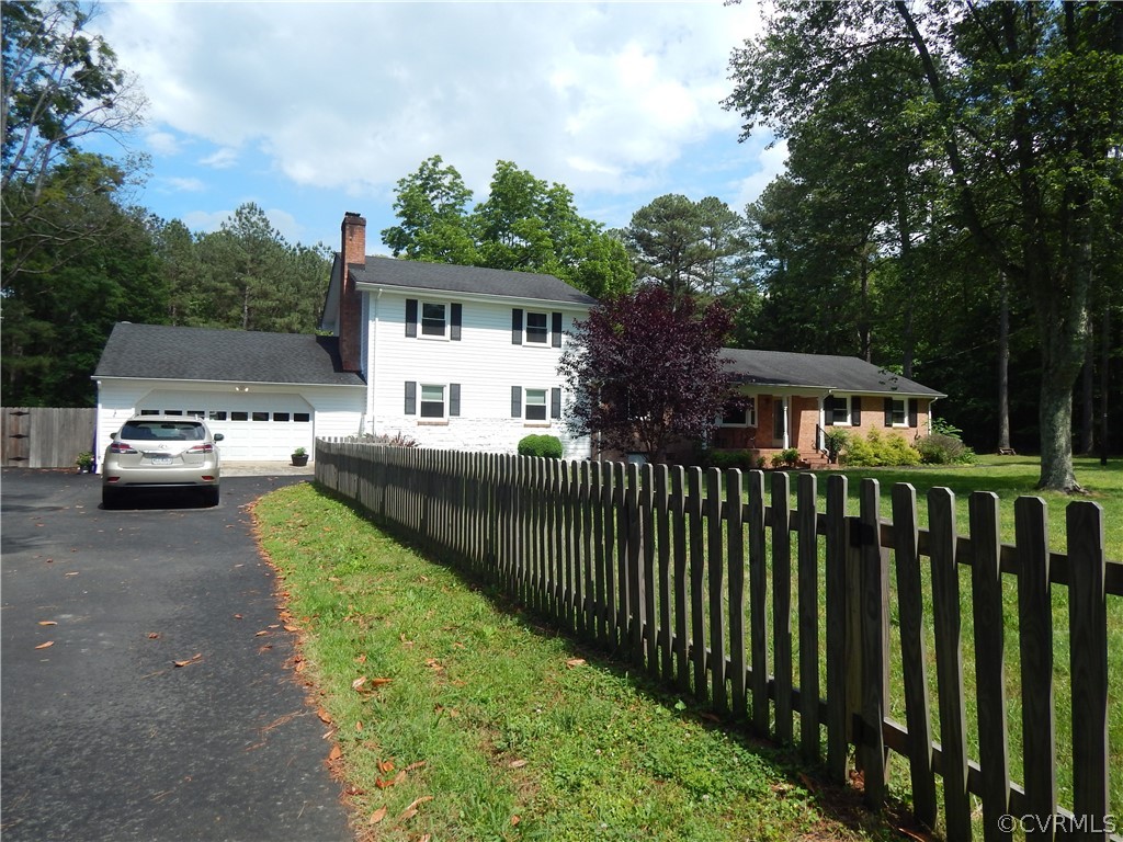 9201 Winterpock Road Chesterfield, VA 23832 - Photo 3 of 28 a view of a house with a small yard and wooden fence