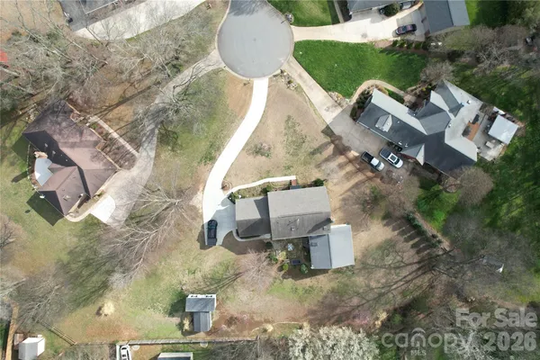 an aerial view of a house with outdoor space