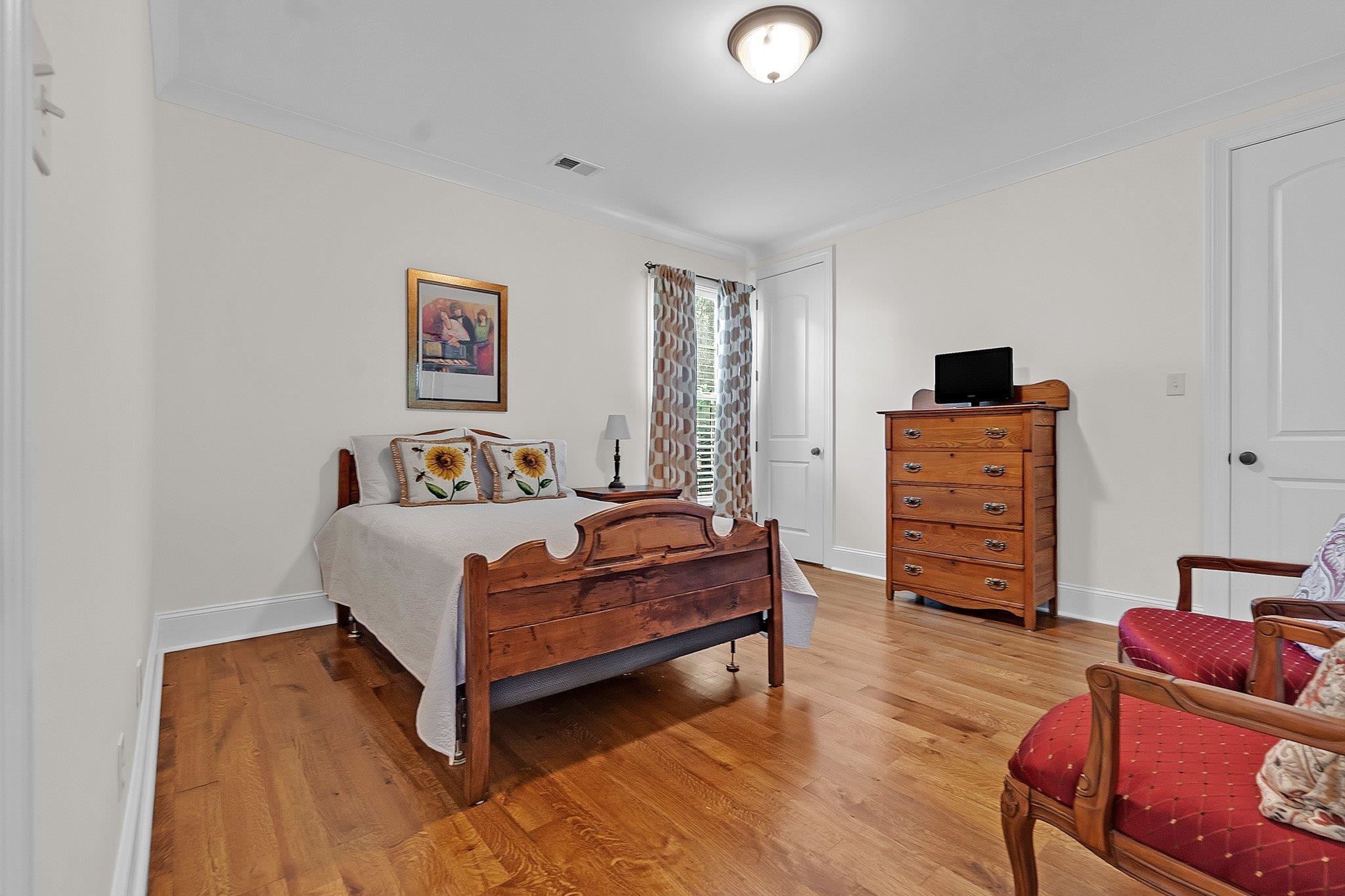 3246 North Hartwell Ridge Drive Collierville, TN 38017 - Photo 13 of 40 Light-filled room featuring wood-finish flooring, white baseboards, and a semi-flush mount ceiling light
