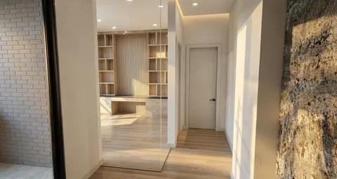 a view of a walk in closet and bathroom
