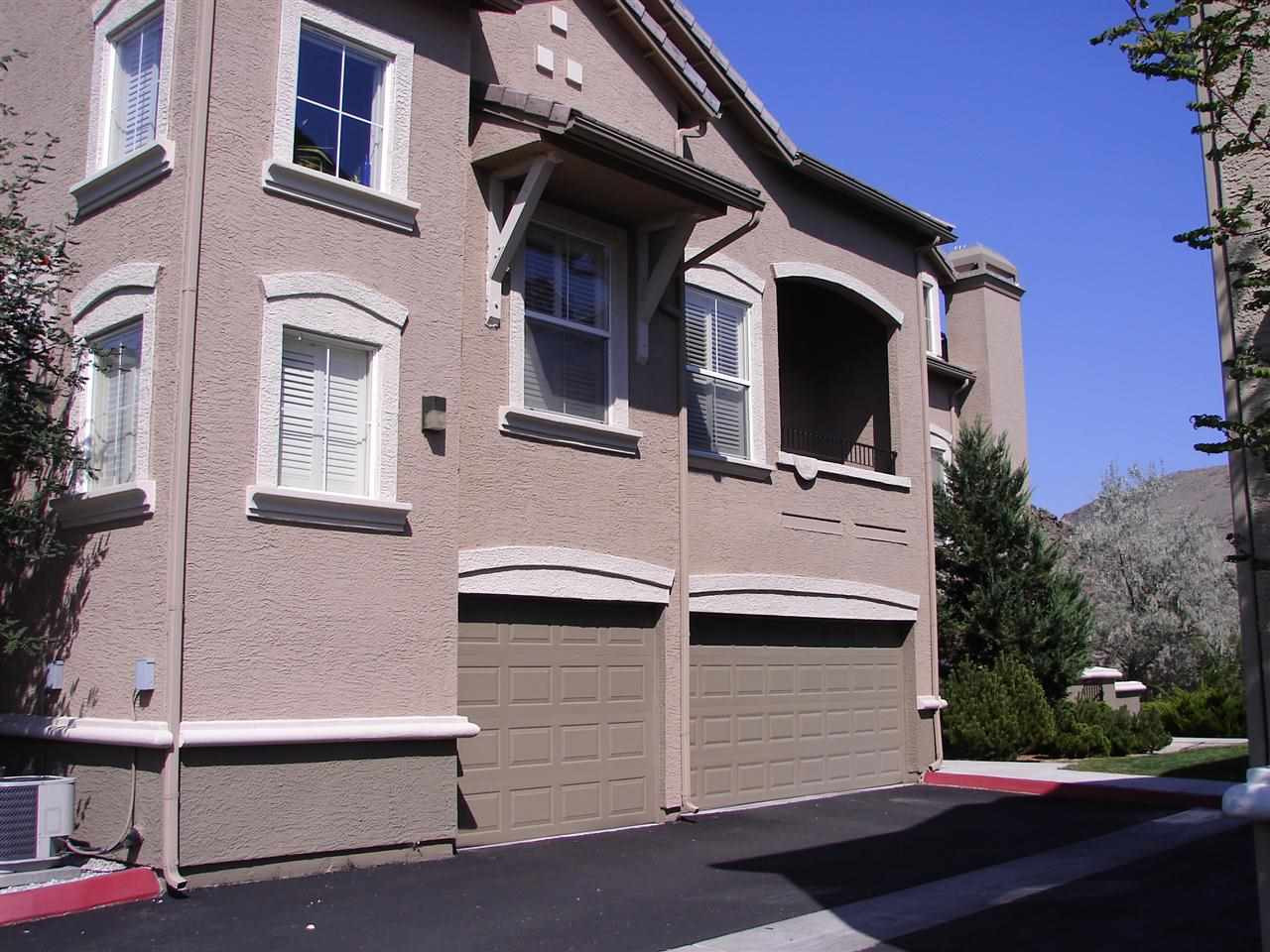 9050 Double R Boulevard, Unit 725 Reno, NV 89521 - Photo 1 of 1 a front view of a house with a garage