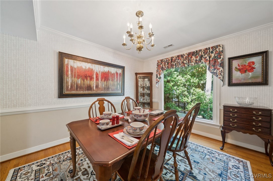 3000 Cove Ridge Road Midlothian, VA 23112 - Photo 13 of 47 a dining room with furniture a large window and a chandelier