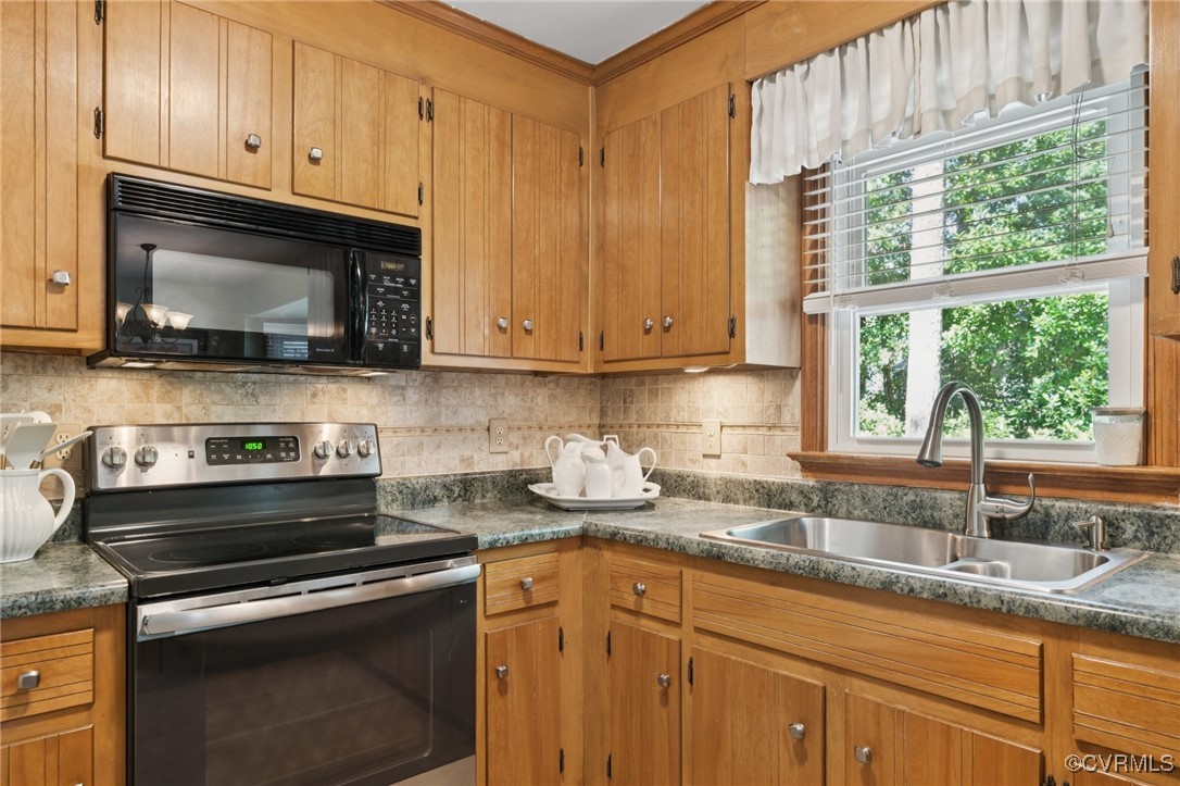3000 Cove Ridge Road Midlothian, VA 23112 - Photo 19 of 47 a kitchen with granite countertop white cabinets appliances and a window