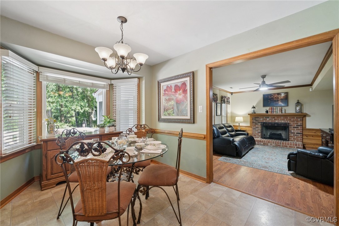3000 Cove Ridge Road Midlothian, VA 23112 - Photo 20 of 47 a view of a dining room with furniture a chandelier and large windows
