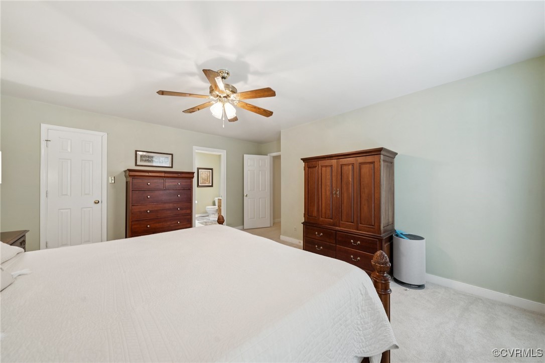 3000 Cove Ridge Road Midlothian, VA 23112 - Photo 30 of 47 a bedroom with a bed and a chandelier