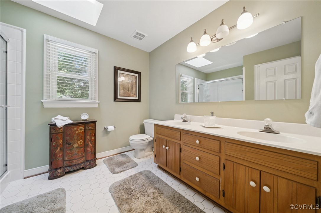 3000 Cove Ridge Road Midlothian, VA 23112 - Photo 32 of 47 a spacious bathroom with double vanity sink a toilet a mirror and vanity