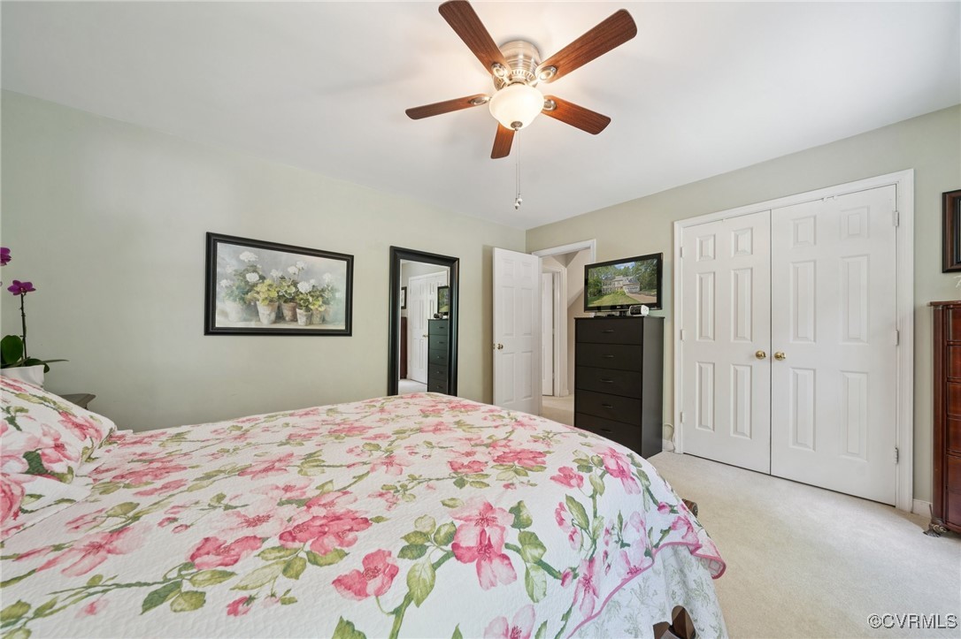 3000 Cove Ridge Road Midlothian, VA 23112 - Photo 33 of 47 a bedroom with a large bed and a chandelier