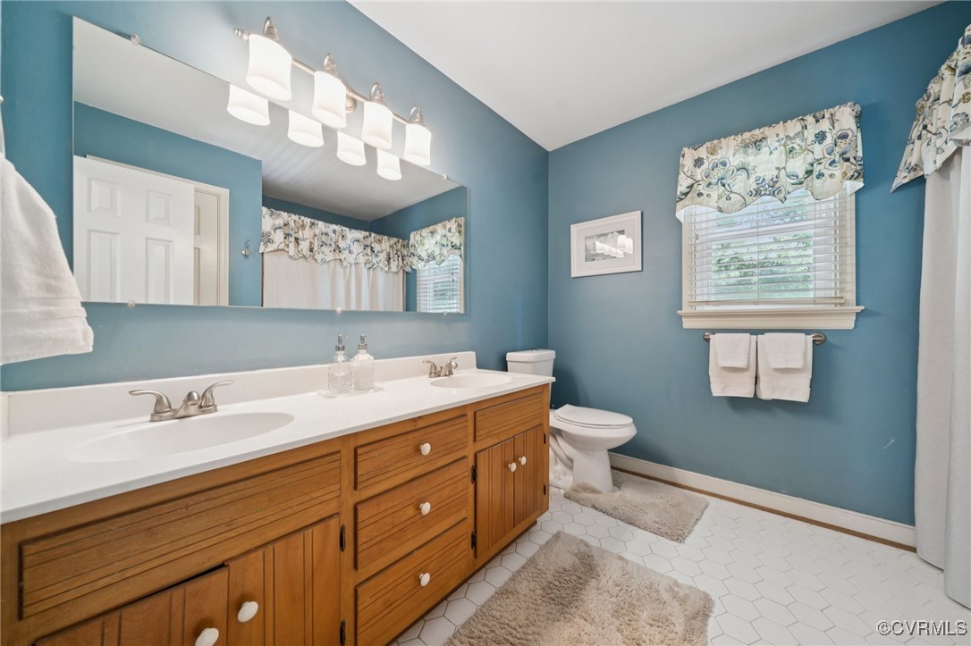 3000 Cove Ridge Road Midlothian, VA 23112 - Photo 39 of 47 a bathroom with a double vanity sink mirror and a toilet