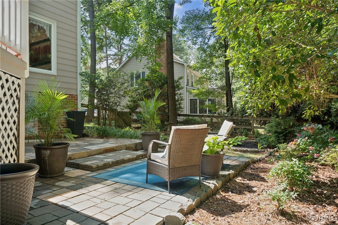 3000 Cove Ridge Road Midlothian, VA 23112 - Photo 44 of 47 a view of a patio with table and chairs and potted plants