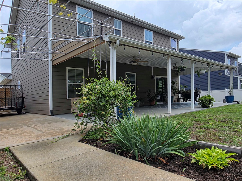 224 Bronson Ridge Anderson, SC 29621 - Photo 32 of 42 An inviting covered patio and lush landscaping define this charming outdoor space.
