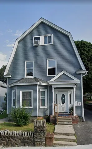 a front view of a house with yard