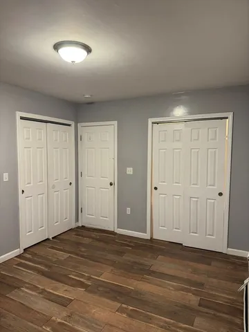 a view of a livingroom with wooden floor