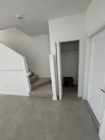 a bathroom with a sink a toilet and a window