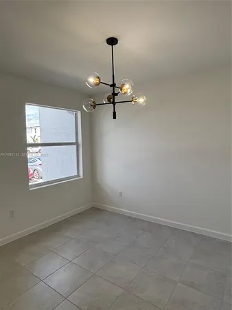 a view of a room with a large window