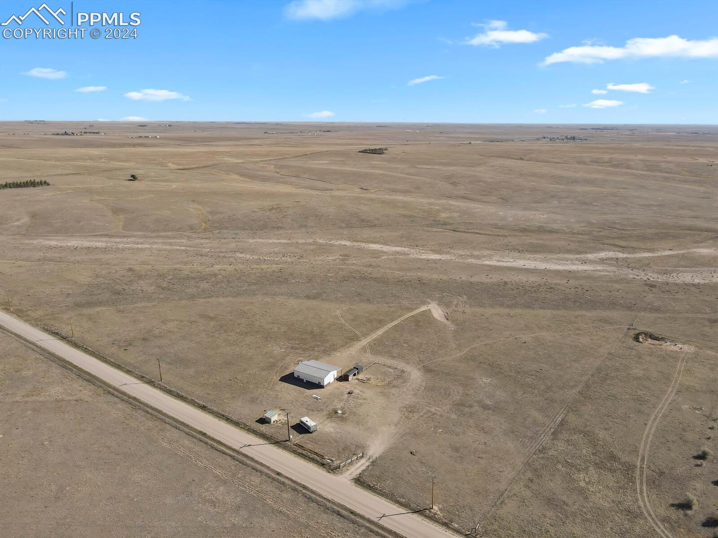 12155 Oil Well Road Calhan, CO 80808 - Photo 22 of 28 Expansive aerial view showing the scale and openness of the property