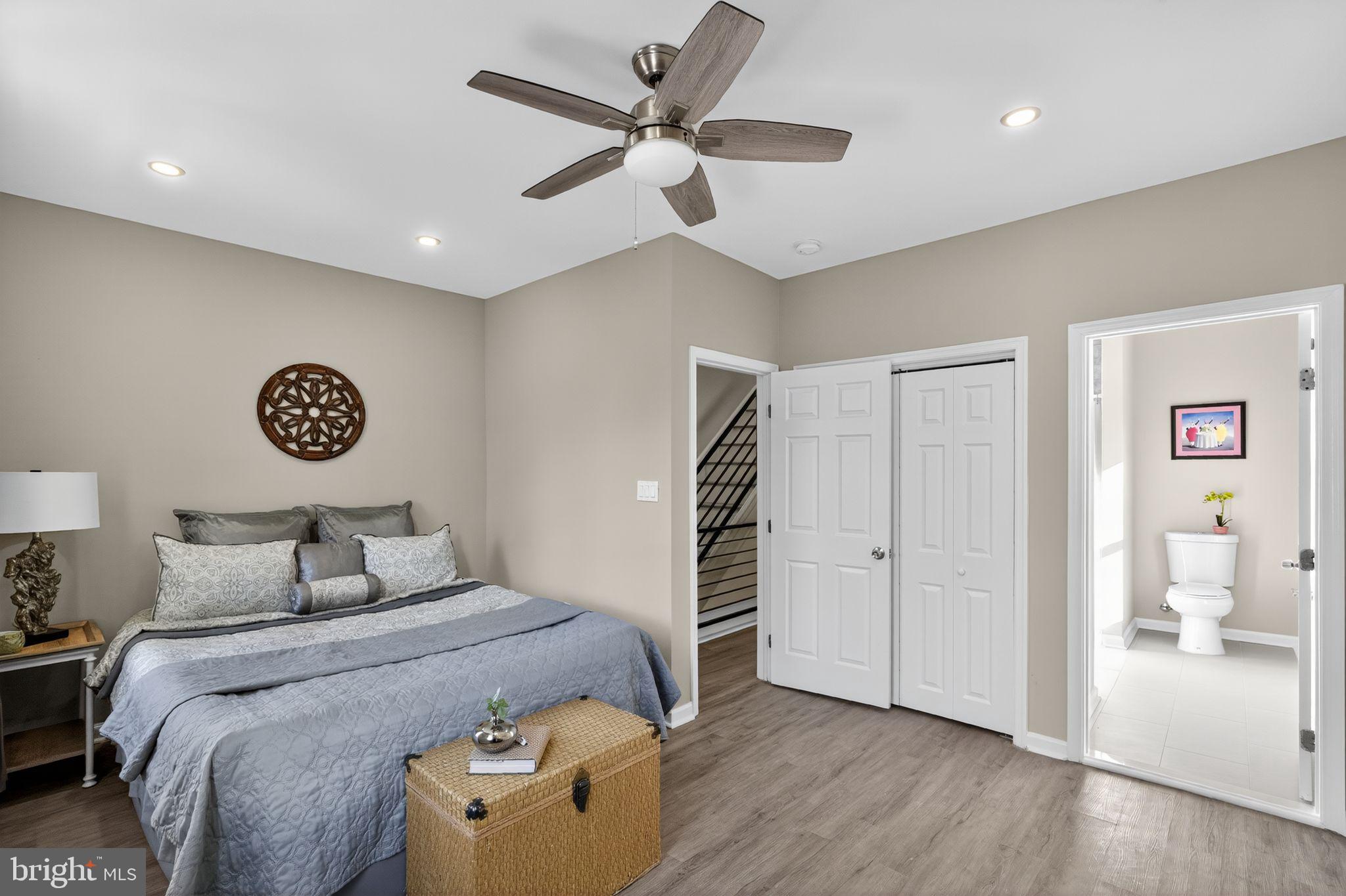 5335 Wakefield Street Philadelphia, PA 19144 - Photo 11 of 30 a bedroom with a large bed and a chandelier