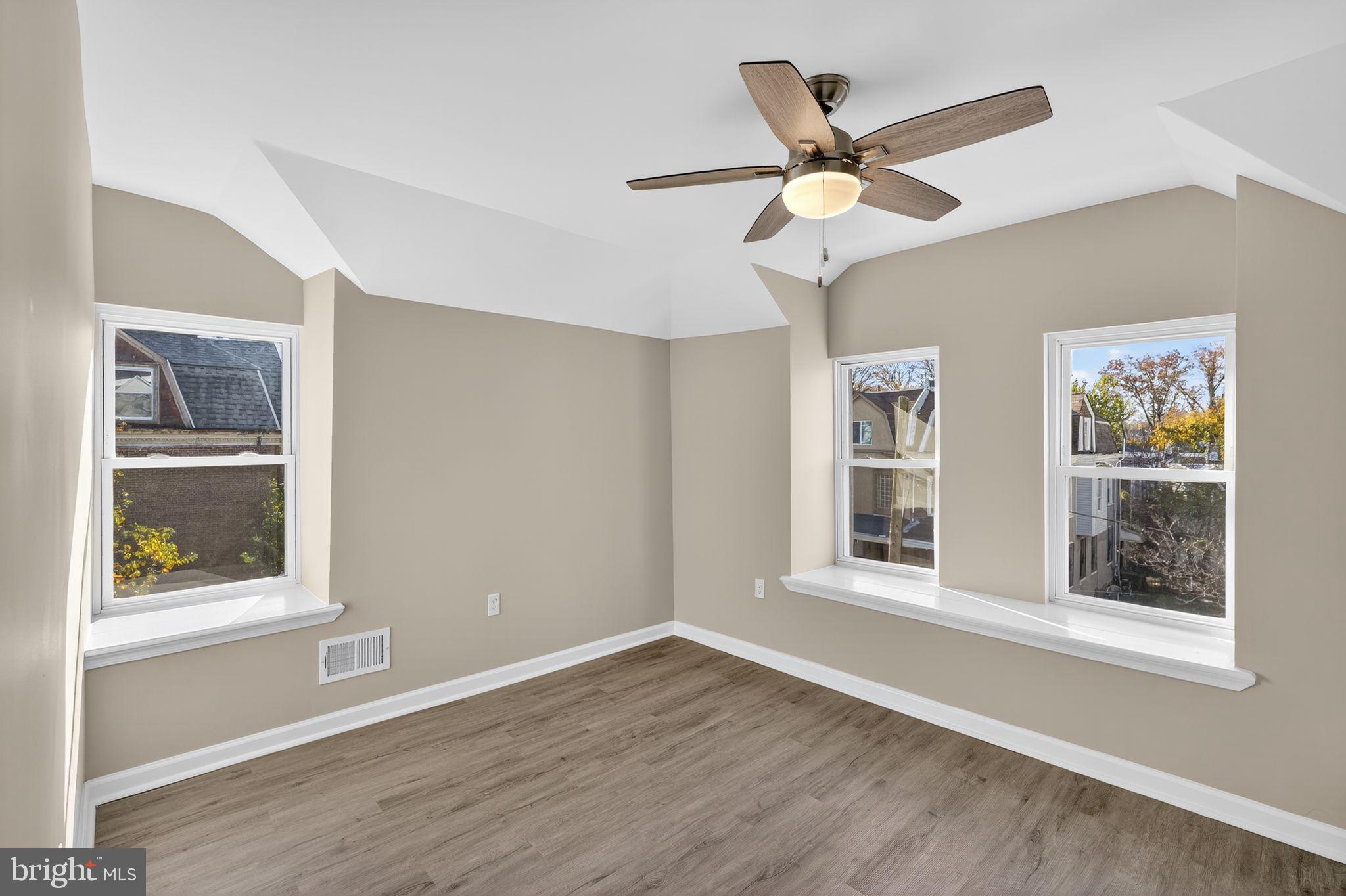 5335 Wakefield Street Philadelphia, PA 19144 - Photo 15 of 30 a view of an empty room with a window and wooden floor
