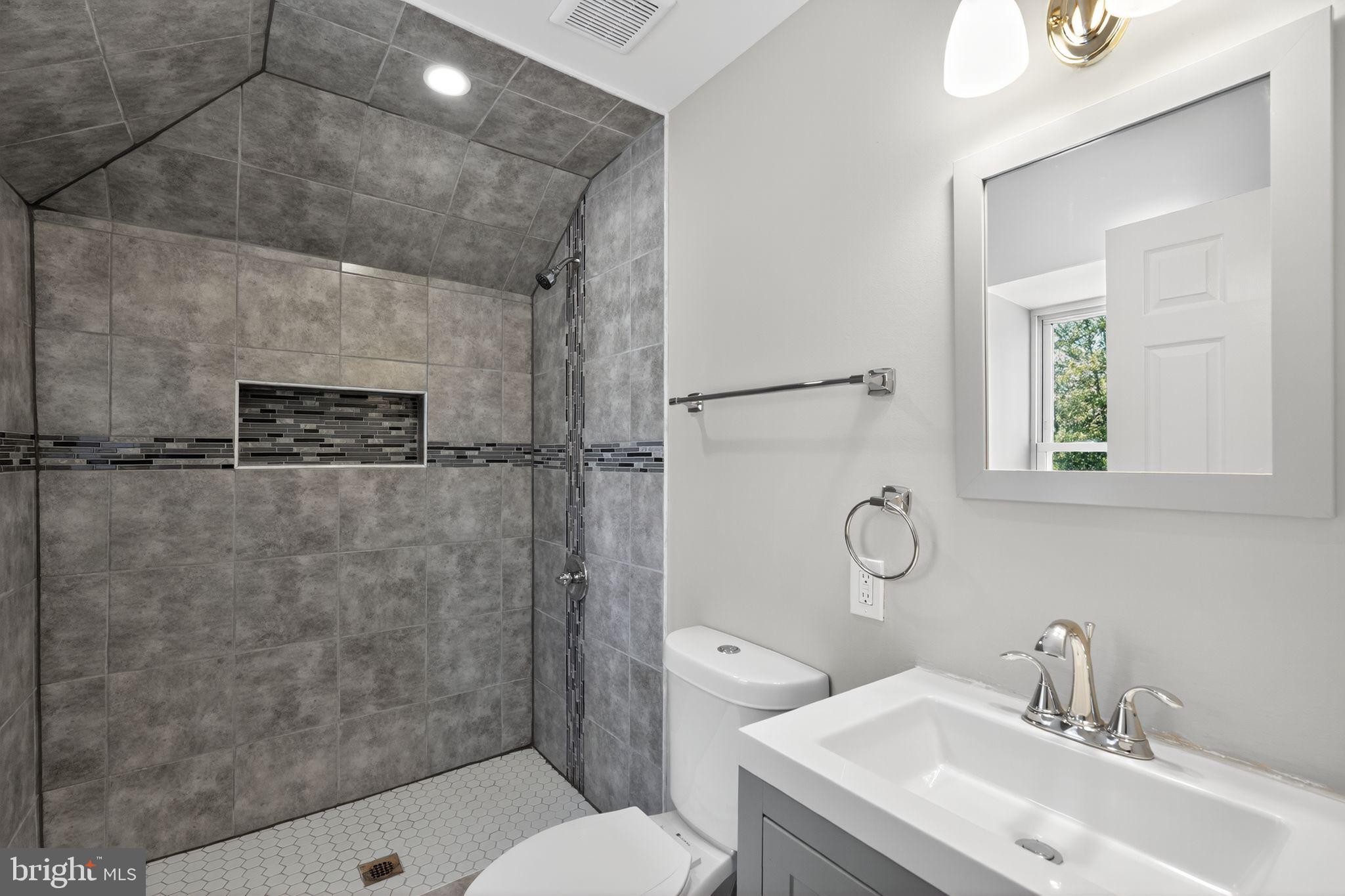 5335 Wakefield Street Philadelphia, PA 19144 - Photo 20 of 30 a bathroom with a sink toilet and shower