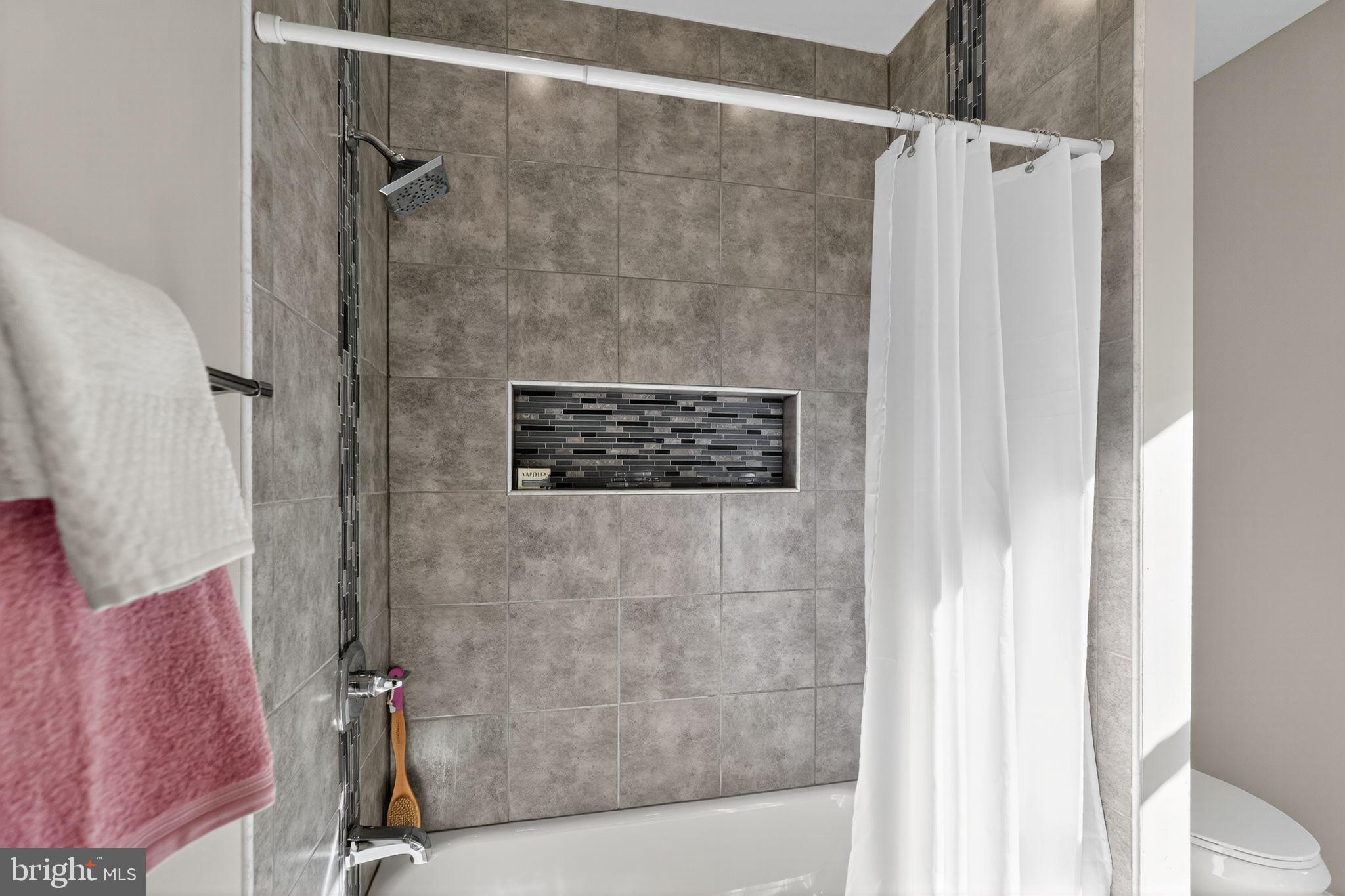 5335 Wakefield Street Philadelphia, PA 19144 - Photo 21 of 30 a bathroom with a shower and a sink