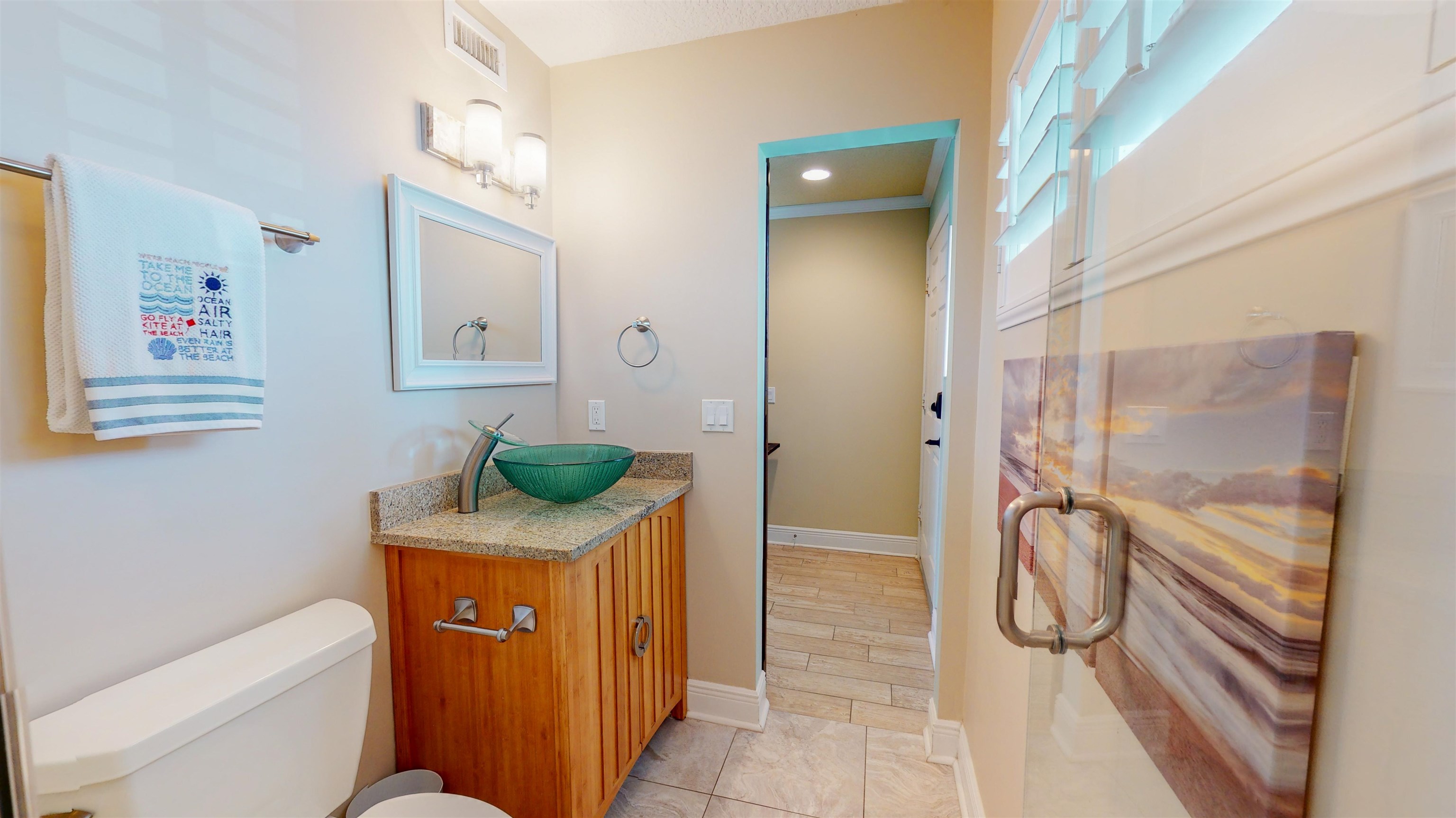 850 A1A Beach Boulevard, Unit 15 St. Augustine, FL 32080 - Photo 14 of 35 a bathroom with a granite countertop sink a toilet and shower