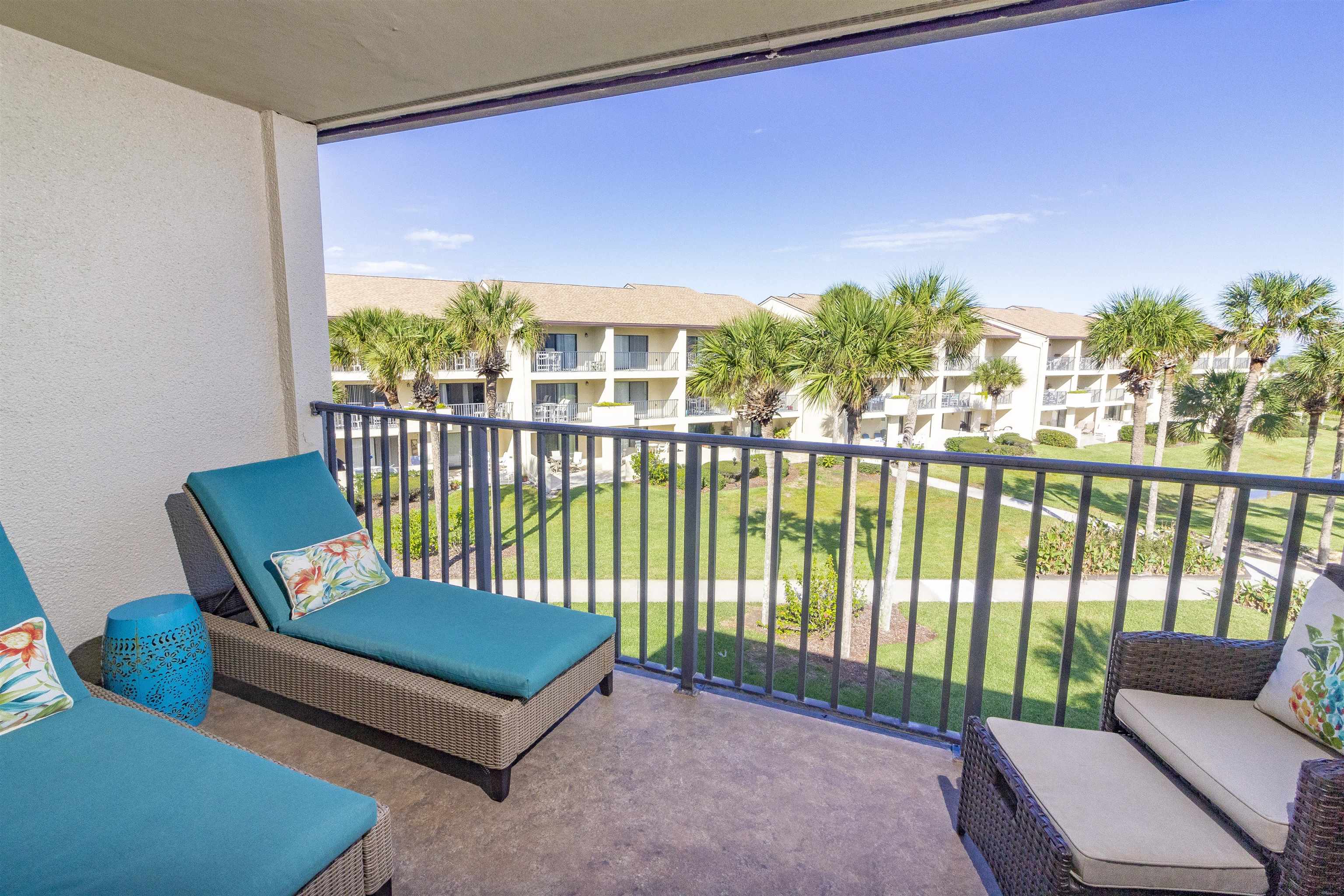 850 A1A Beach Boulevard, Unit 15 St. Augustine, FL 32080 - Photo 20 of 35 a backyard of a house with lake view and a potted plant