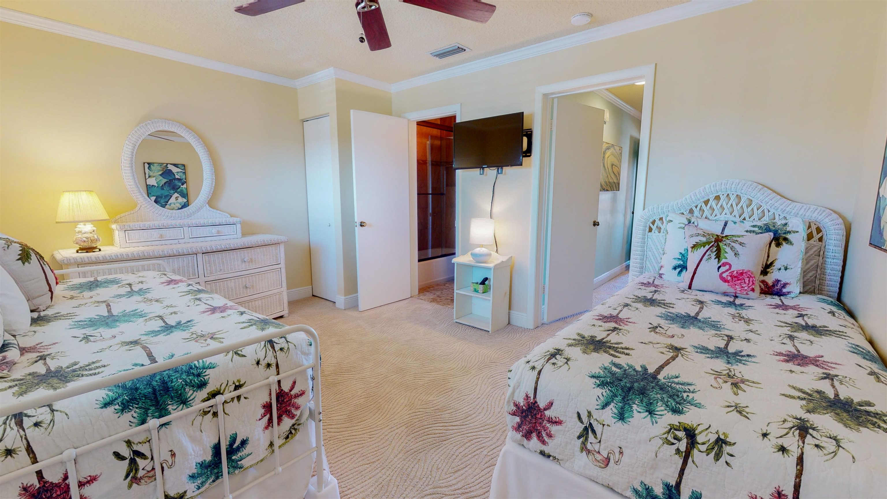 850 A1A Beach Boulevard, Unit 15 St. Augustine, FL 32080 - Photo 25 of 35 a bedroom with a bed and a chandelier