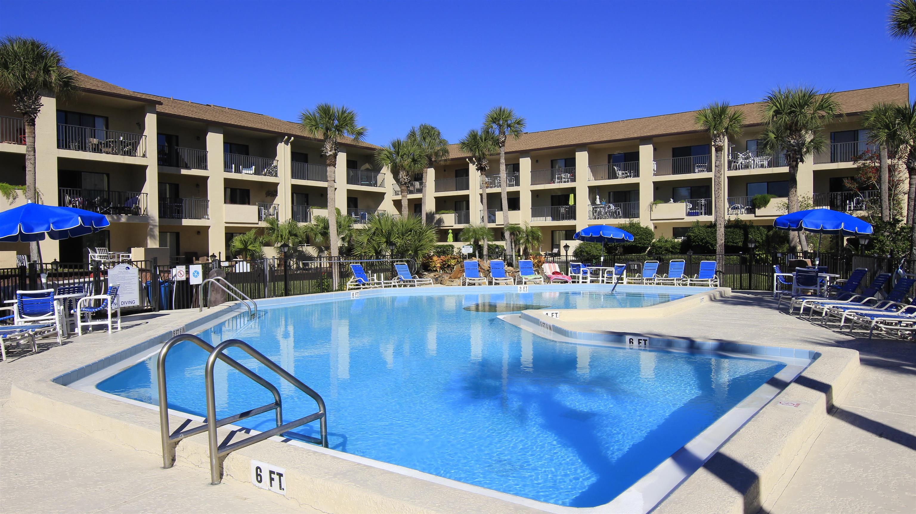 850 A1A Beach Boulevard, Unit 15 St. Augustine, FL 32080 - Photo 31 of 35 a view of a swimming pool with chairs
