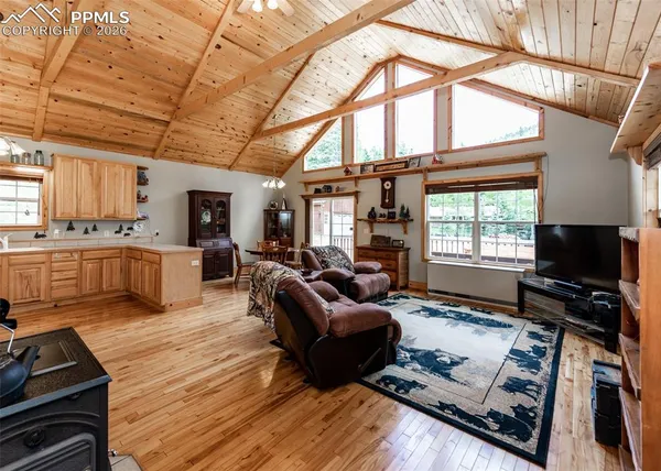 a bed room with furniture and a large window