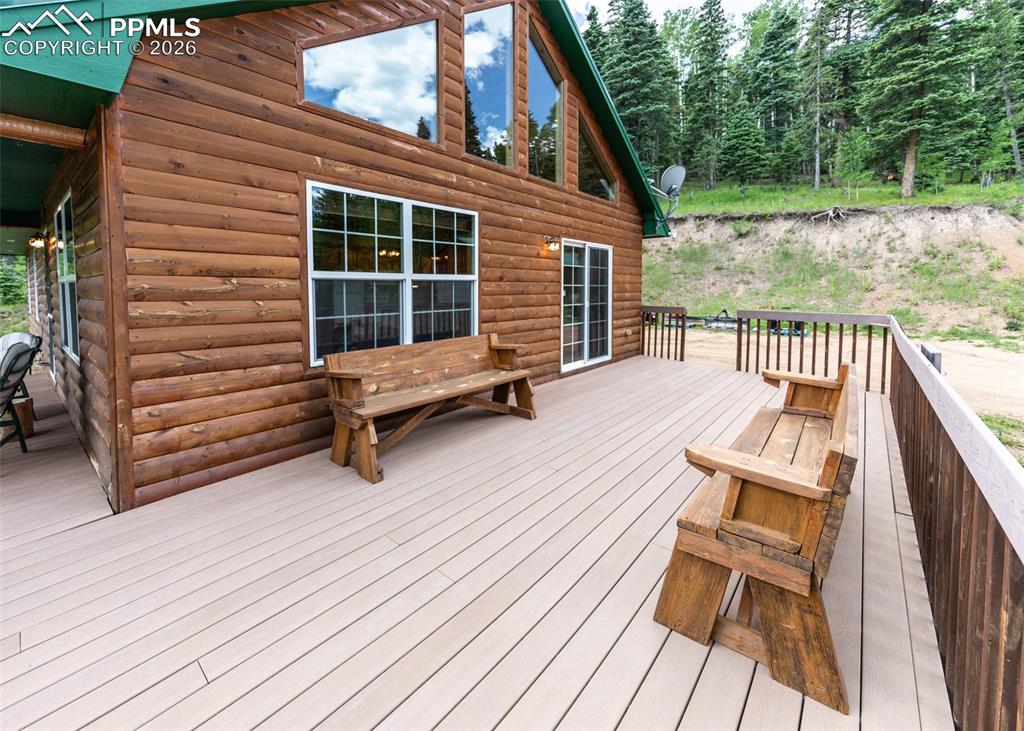 331 Westcliffe Drive Rye, CO 81069 - Photo 24 of 50 a balcony with wooden floor and outdoor seating