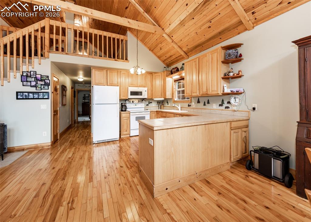 331 Westcliffe Drive Rye, CO 81069 - Photo 31 of 50 a kitchen that has a lot of cabinets in it with stainless steel appliances
