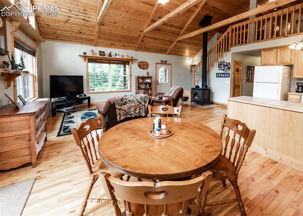 331 Westcliffe Drive Rye, CO 81069 - Photo 36 of 50 a dining room with furniture a fireplace and wooden floor
