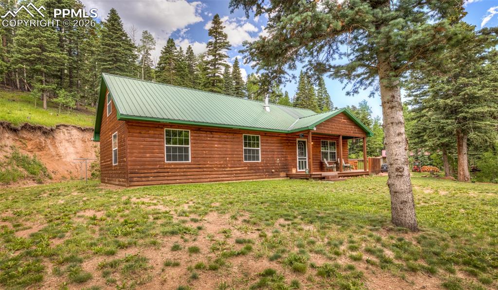 331 Westcliffe Drive Rye, CO 81069 - Photo 8 of 50 a front view of a house with garden