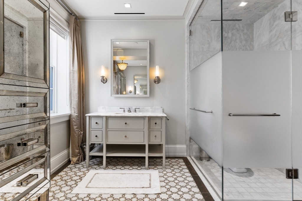 25 Beacon Street, Unit 4 Boston, MA 02108 - Photo 22 of 41 a bathroom with a sink and a mirror
