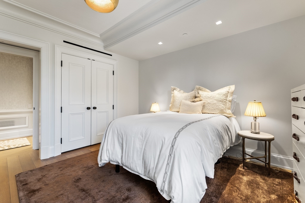 25 Beacon Street, Unit 4 Boston, MA 02108 - Photo 30 of 41 a bedroom with a bed and a window