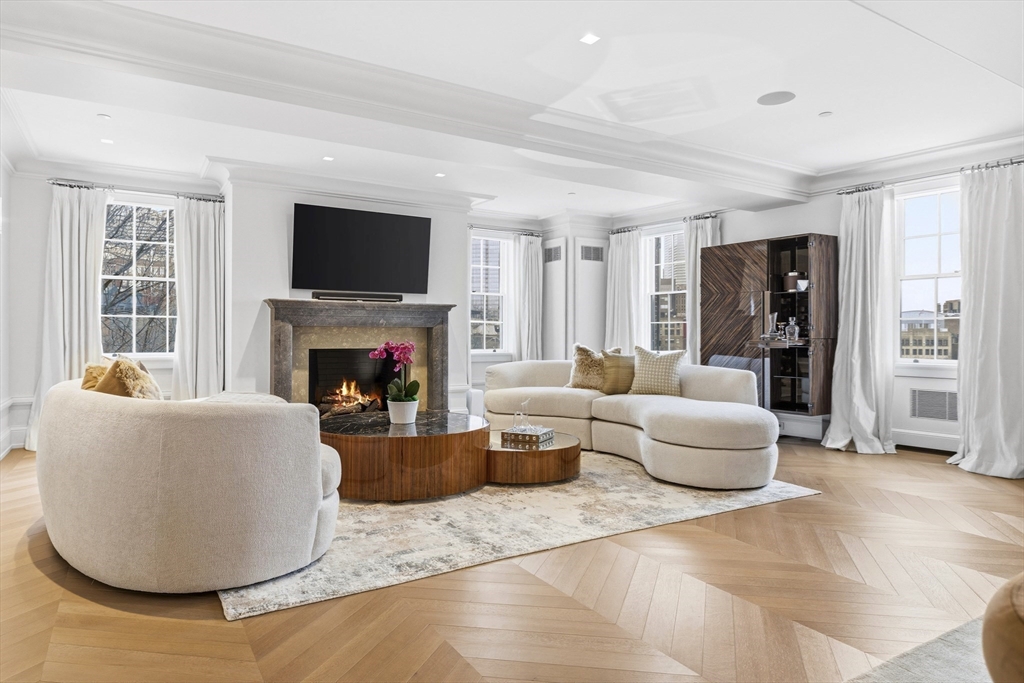 25 Beacon Street, Unit 4 Boston, MA 02108 - Photo 6 of 41 a living room with furniture and a fireplace