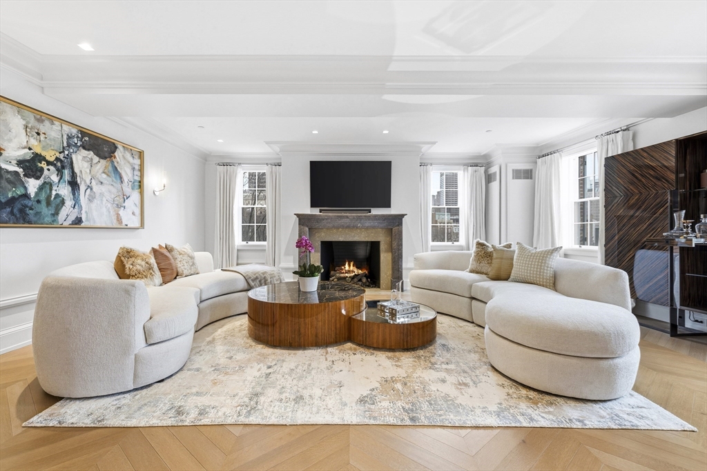 25 Beacon Street, Unit 4 Boston, MA 02108 - Photo 7 of 41 a living room with furniture and a fireplace